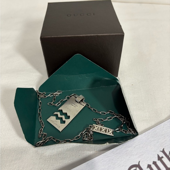 Authentic GUCCI Sterling silver Aquarius necklace with bonus and COA